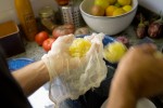 Straining Lemons Through Cheesecloth for the A-1 Pick-Me-Up Cocktail
